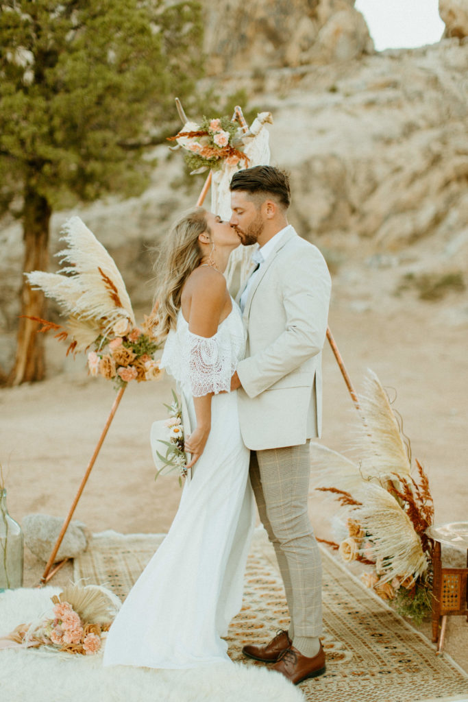 Reno Wedding Photographer captures bride and groom kissing at later