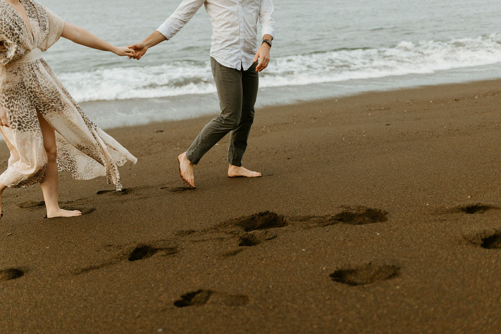 Reno Wedding Photographer captures couple walking on beach after perfect proposal