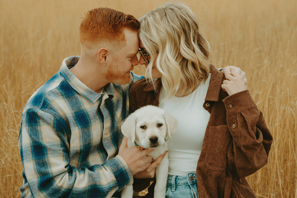 Wedding Photographers Reno capture couple hugging while holding dog