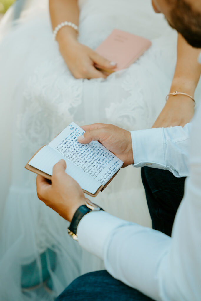Reno wedding photographer captures groom reading vows to bride