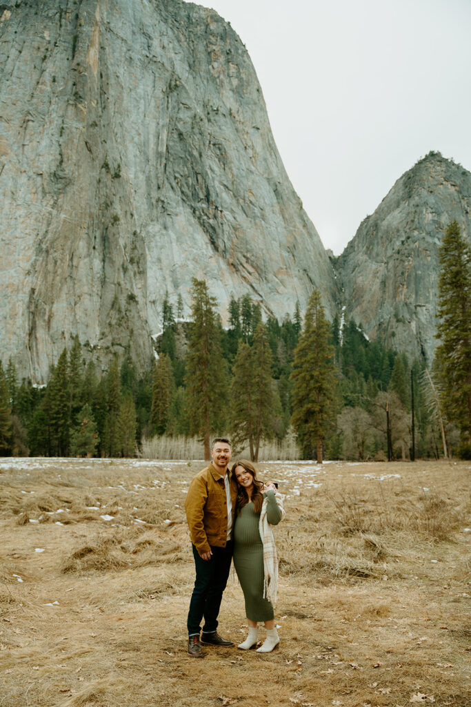Yosemite wedding photographer captures couple standing together celebrating pregnancy and upcoming baby