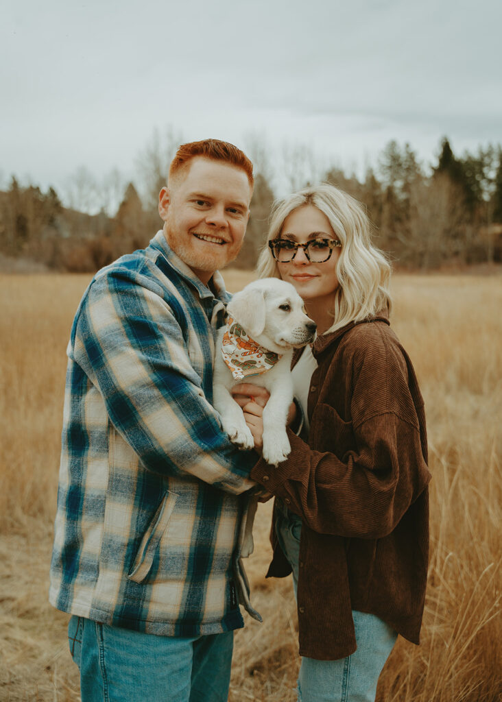 Reno wedding photographer captures couple holding puppy during engagement session
