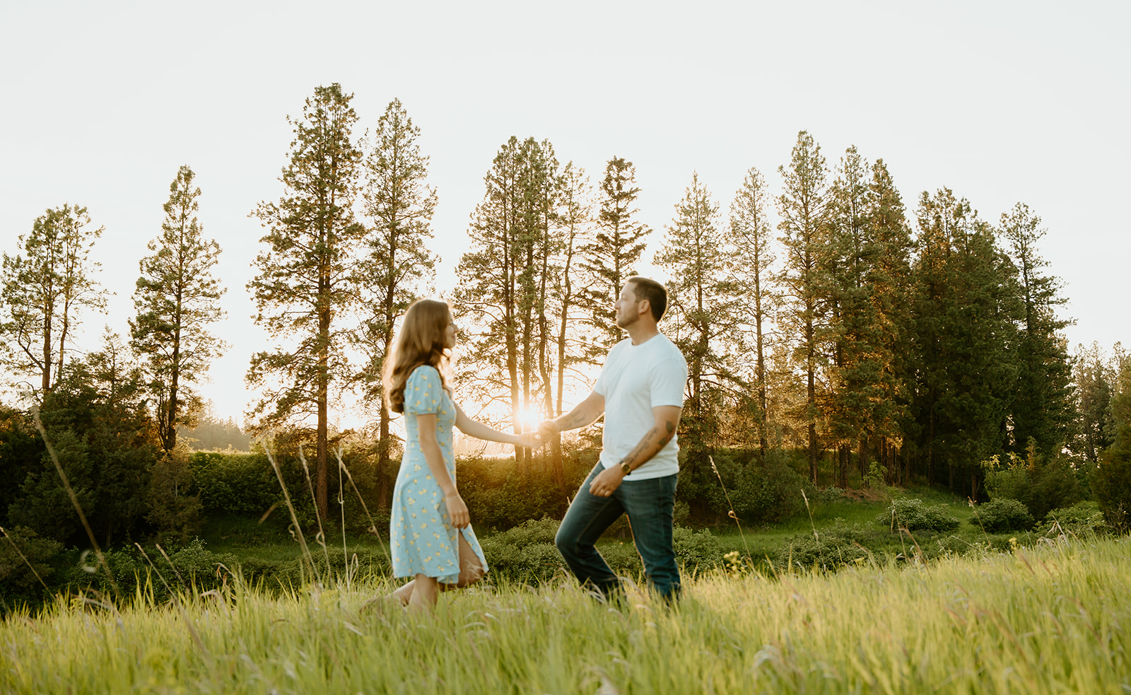 Reno wedding photographer captures man and woman walking towards one another at golden hour