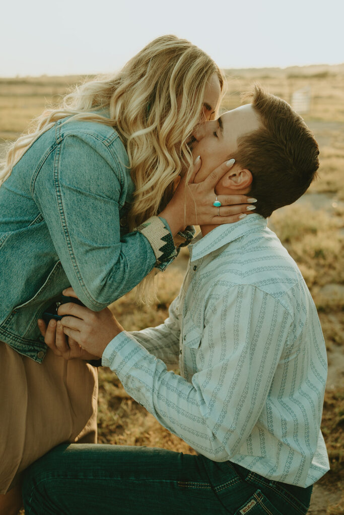 Reno wedding photographer captures man and woman kissing after surprise proposal