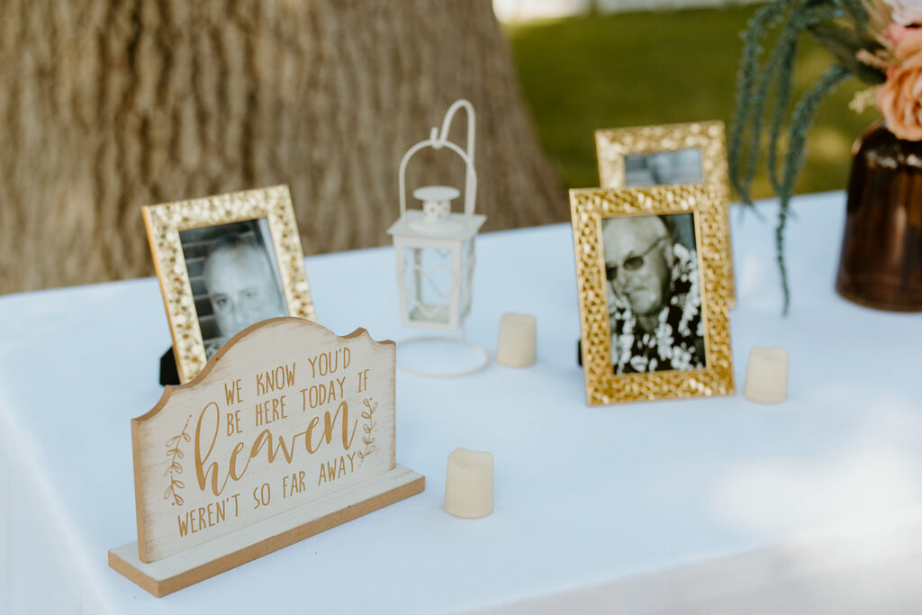 Reno wedding photographer captures table of photos of loved ones at Reno wedding ceremony