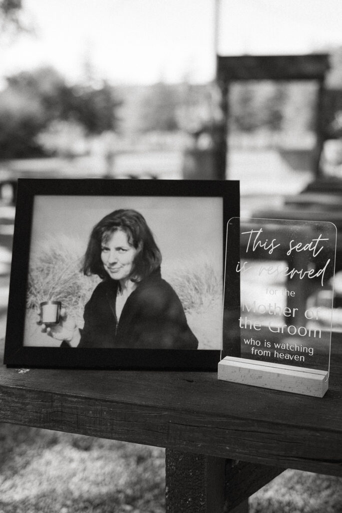 Reno wedding photographer captures photo of family member that has passed and reserved seating sign at Reno wedding