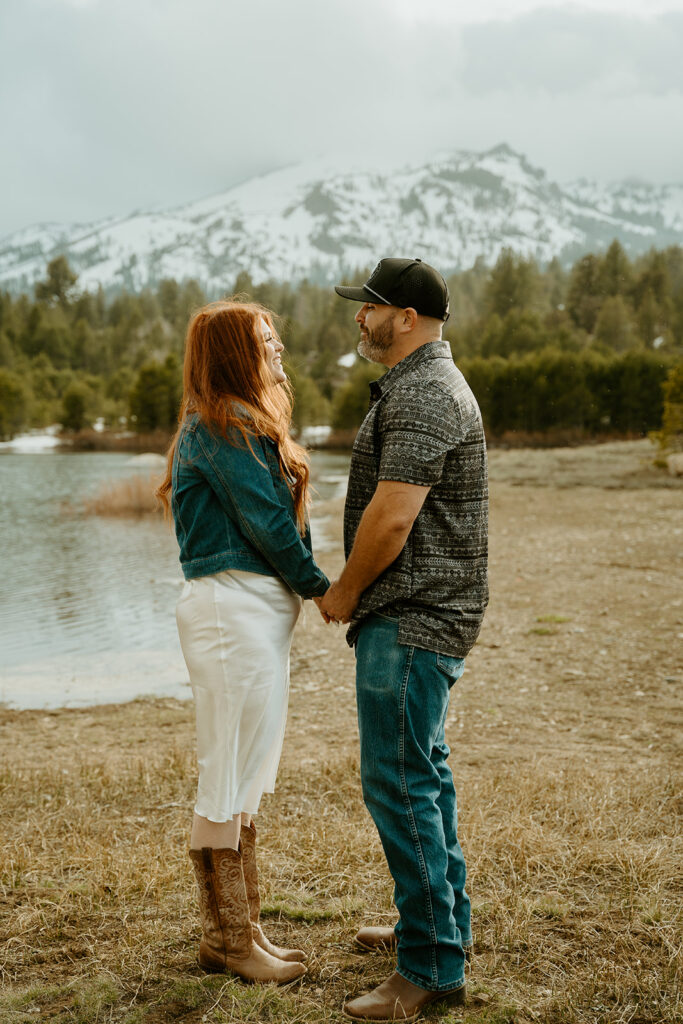 Reno wedding photographer captures man and woman holding hands during outdoor engagement photos