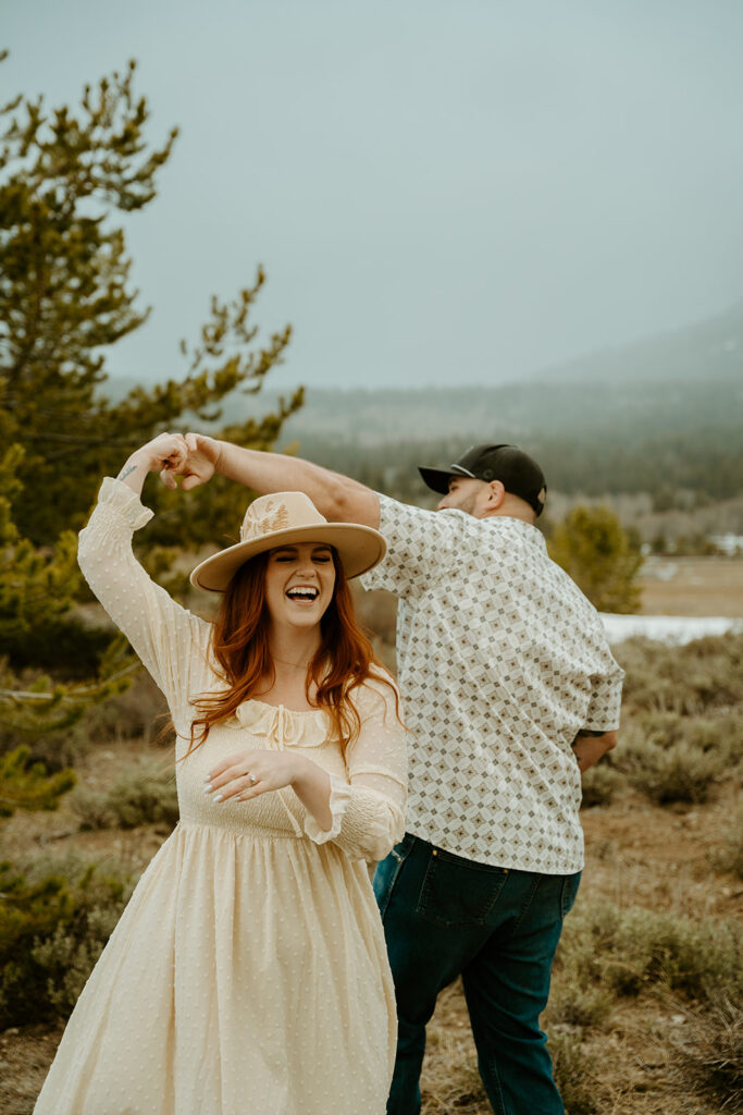 Reno wedding photographer captures engaged couple dancing together during summer engagement photos