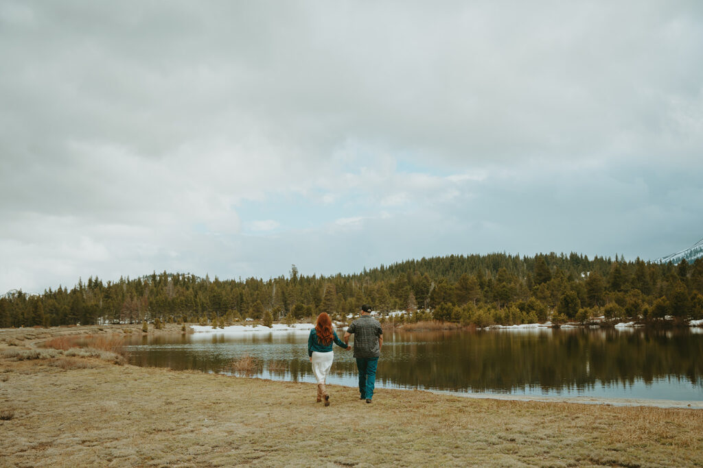 Reno wedding photographer captures man and woman walking off into distance with Hope Valley in the distance