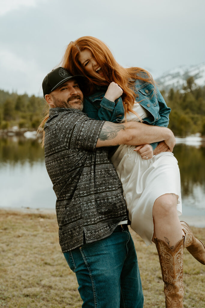 Reno wedding photographer captures man lifting woman up during engagement photos