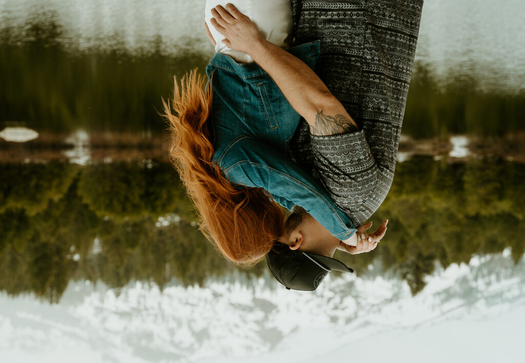 Reno wedding photographer captures couple hugging and kissing during outdoor engagement photos