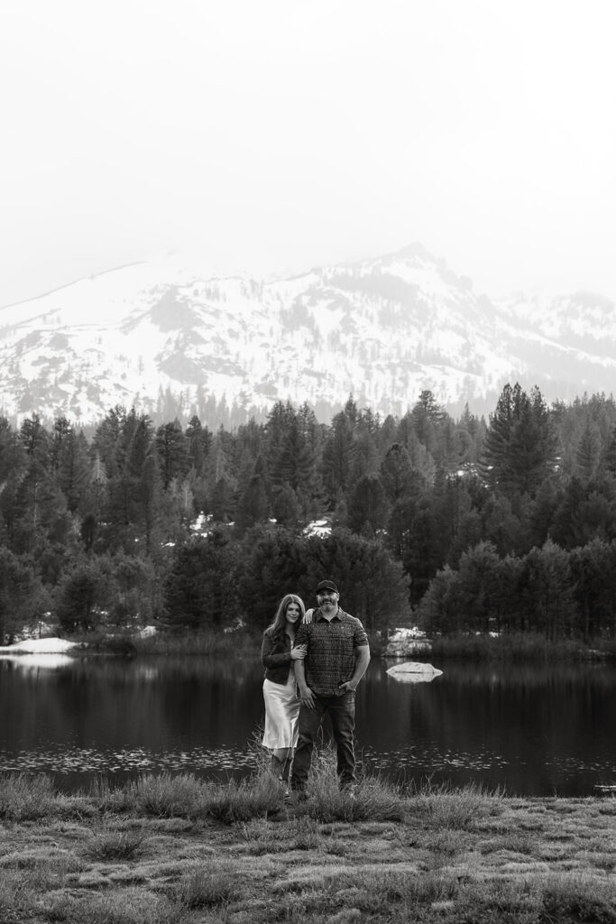 Reno wedding photographer captures couple standing together in front of lake