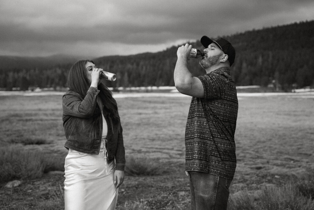 Reno wedding photographer captures engaged couple drinking together during spring engagement. photos