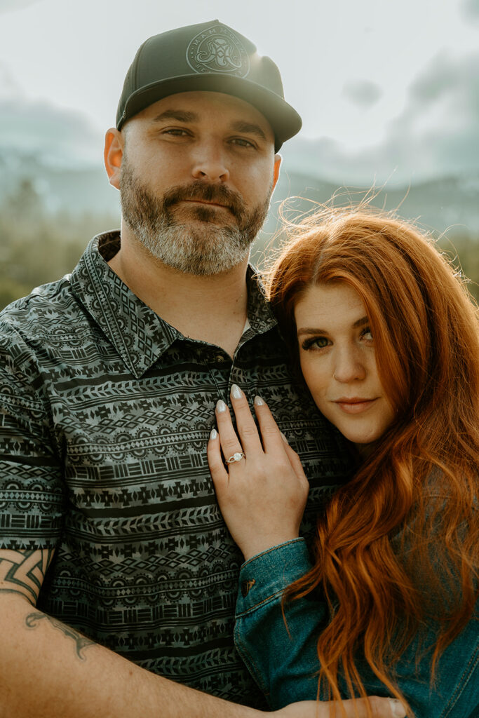 Reno wedding photographer captures couple embracing while woman places hand on man's chest