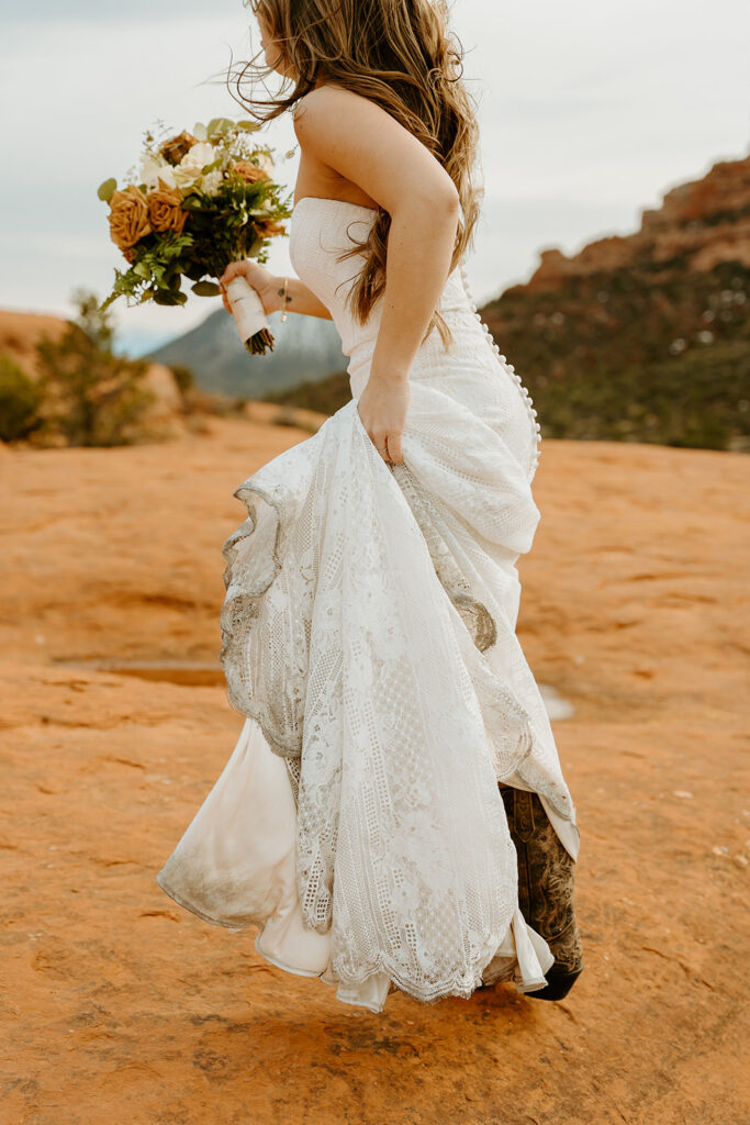 Reno Wedding Photographer captures bride holding dress train