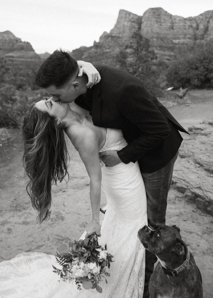 Wedding Photographers Reno capture groom dip-kissing bride during intimate wedding portraits