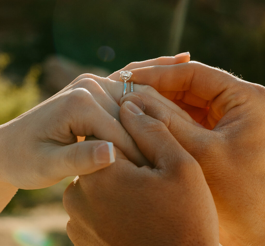 Destination Wedding Photographer captures close up of bride and groom's hands with wedding rings