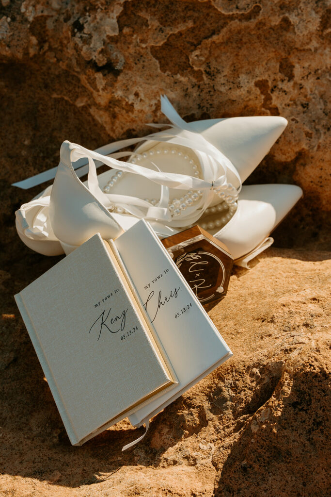 Destination Wedding Photographer captures details from national park weddings with vow books and bridal shoes