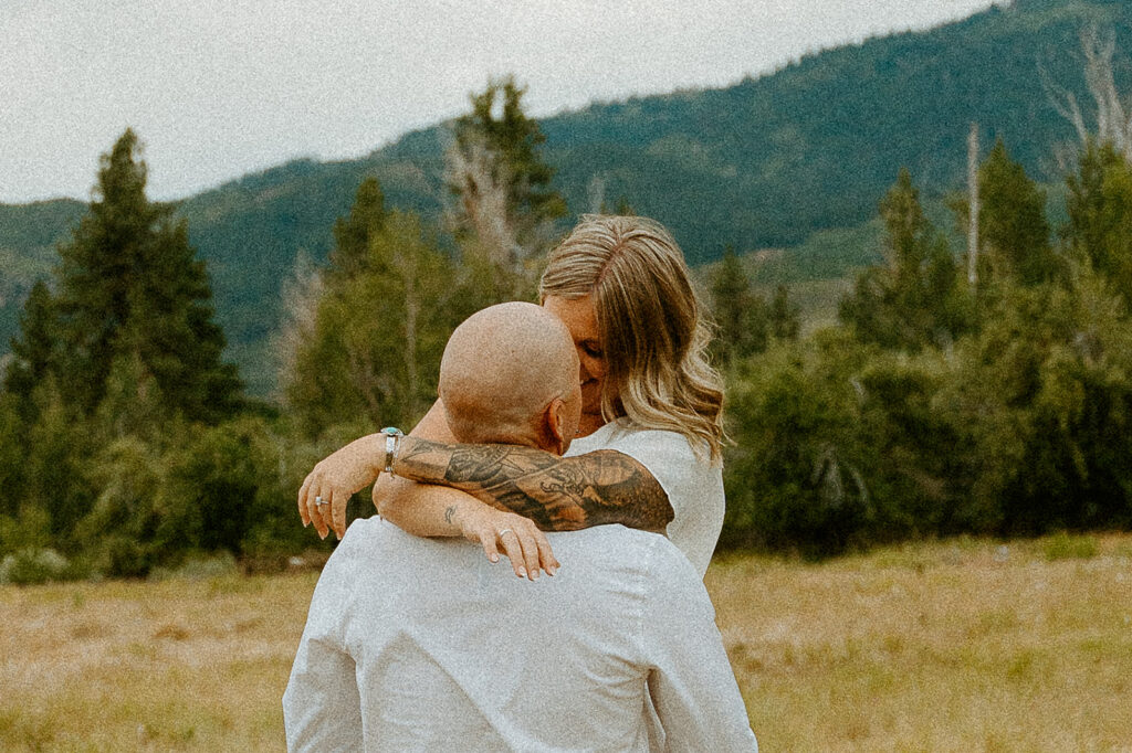 Reno Wedding Photographer captures woman wrapping arms around man's neck