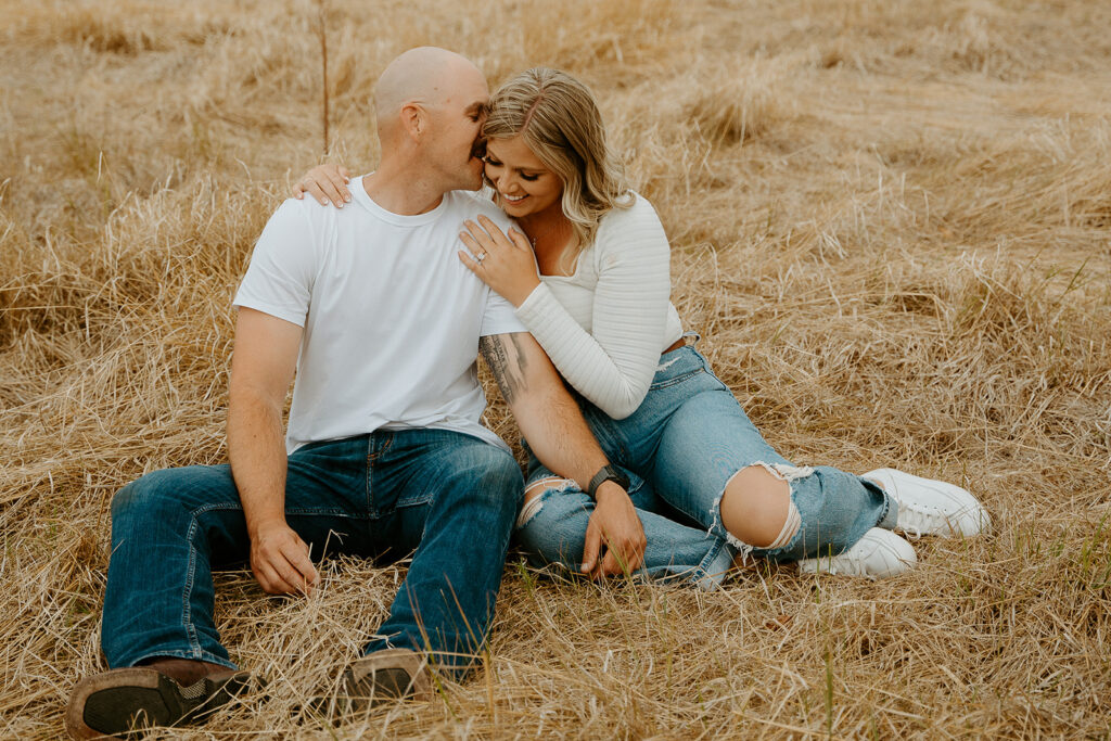 Reno Wedding Photographer captures couple sitting together and cuddling