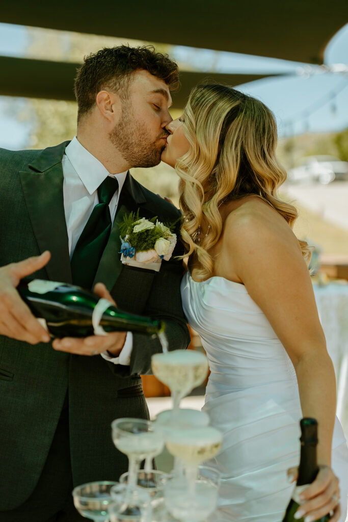 Reno Wedding Photographer captures bride and groom kissing during memorable cocktail hour