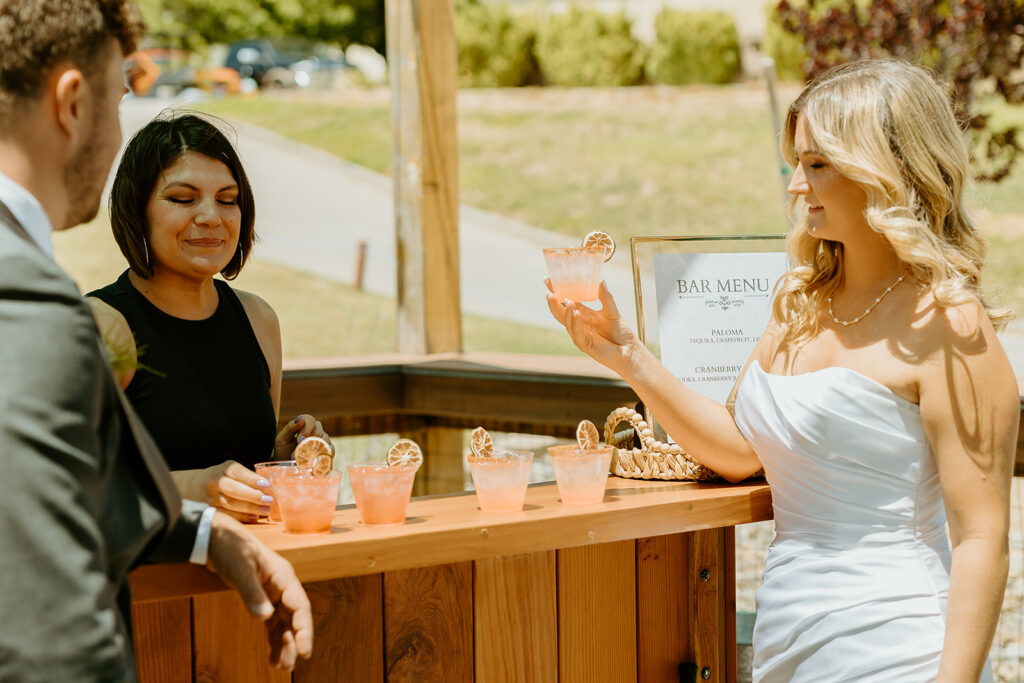 Reno Wedding Photographer captures bride and groom drinking signature drinks at wedding