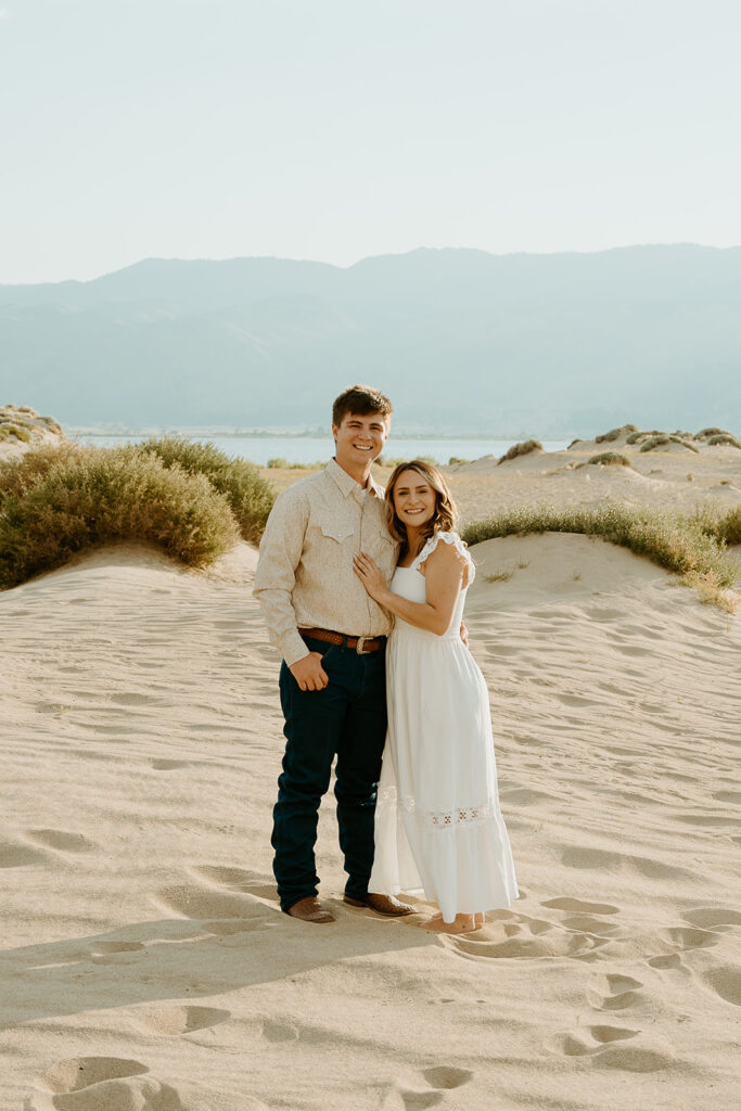 Reno Wedding Photographer captures couple hugging during summer engagement photos