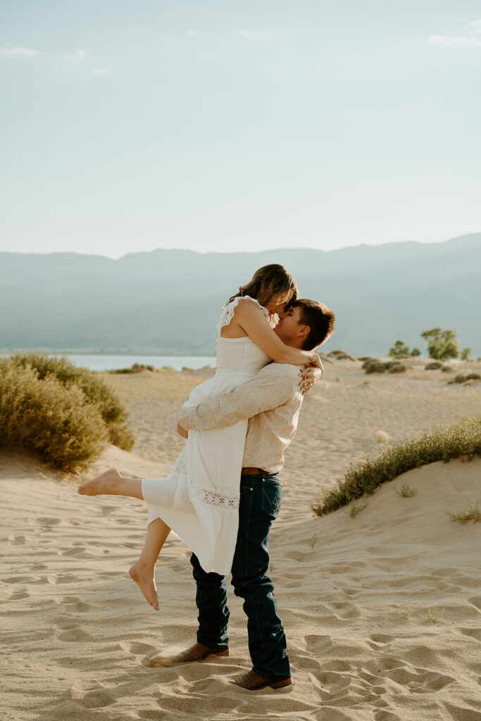 Reno Wedding Photographer captures man lifting woman in air